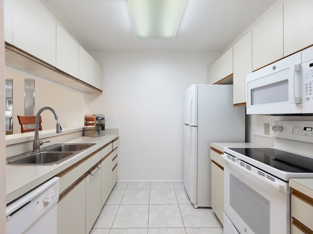 kitchen featuring sink, white cabinets, white appliances, and light tile patterned floors