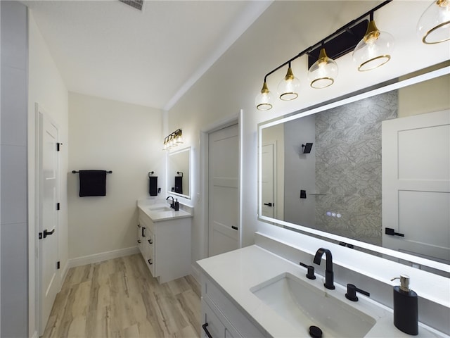 bathroom with vanity and hardwood / wood-style flooring