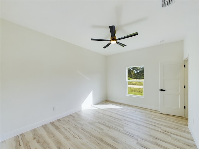 empty room featuring ceiling fan and light hardwood / wood-style floors