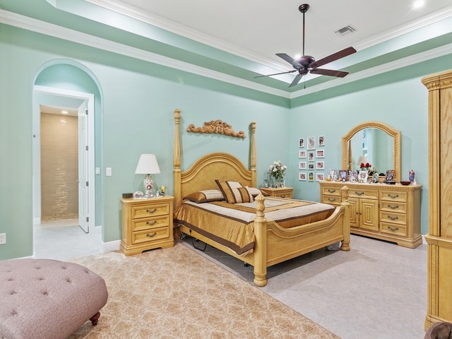 carpeted bedroom with ceiling fan and ornamental molding