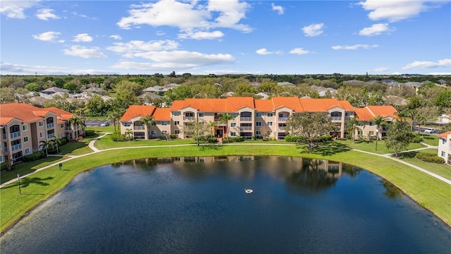 birds eye view of property featuring a water view and a residential view