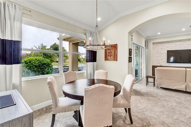 777 Fortunella Cir SW, Vero Beach, FL 32968 - dining area with lofted ceiling, arched walkways, crown molding, baseboards, and a chandelier
