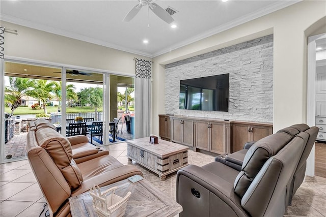 777 Fortunella Cir SW, Vero Beach, FL 32968 - living room with light tile patterned flooring, visible vents, crown molding, and a ceiling fan