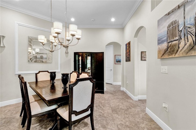 777 Fortunella Cir SW, Vero Beach, FL 32968 - dining space with arched walkways, baseboards, crown molding, and an inviting chandelier