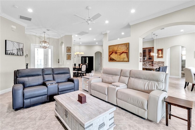 777 Fortunella Cir SW, Vero Beach, FL 32968 - living area featuring visible vents, recessed lighting, arched walkways, crown molding, and ceiling fan with notable chandelier