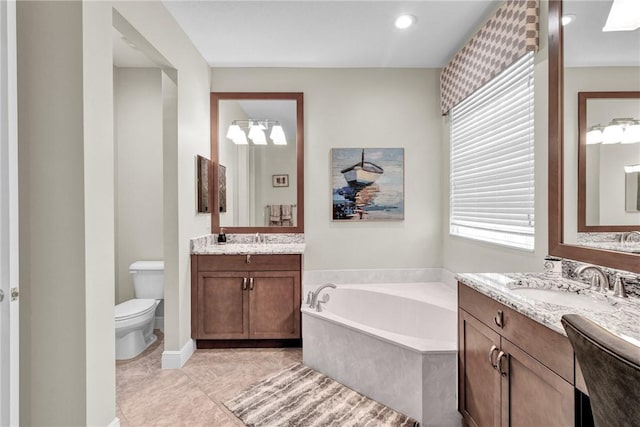 777 Fortunella Cir SW, Vero Beach, FL 32968 - full bathroom with a sink, a garden tub, two vanities, and toilet