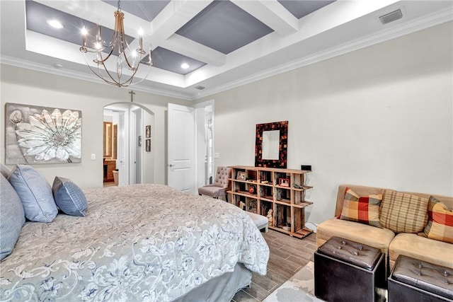 777 Fortunella Cir SW, Vero Beach, FL 32968 - bedroom featuring visible vents, coffered ceiling, arched walkways, an inviting chandelier, and wood tiled floor