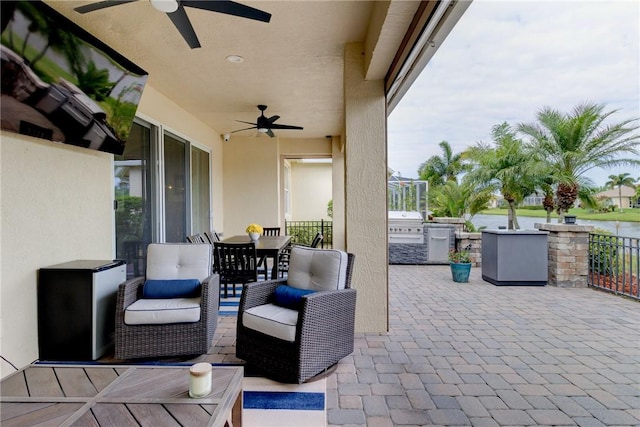 777 Fortunella Cir SW, Vero Beach, FL 32968 - view of patio / terrace featuring ceiling fan, outdoor dining area, area for grilling, and an outdoor kitchen