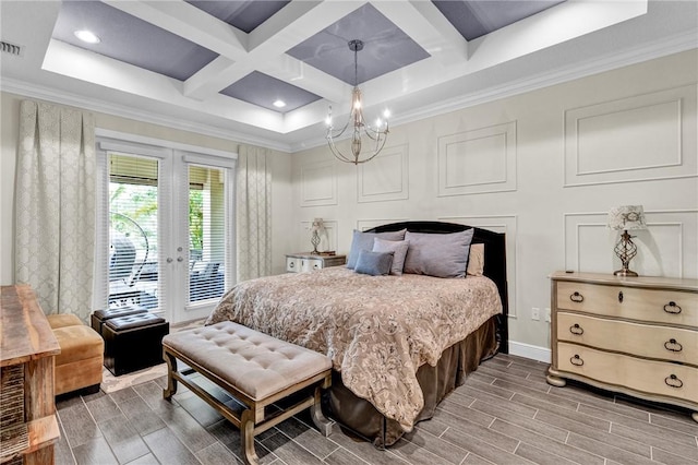 777 Fortunella Cir SW, Vero Beach, FL 32968 - bedroom featuring wood tiled floor, a chandelier, french doors, a decorative wall, and access to outside