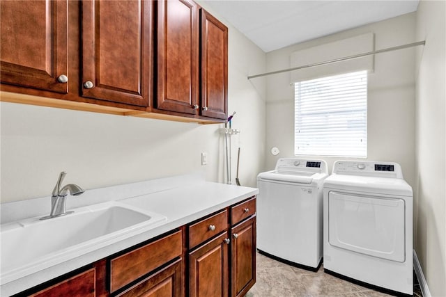 777 Fortunella Cir SW, Vero Beach, FL 32968 - clothes washing area featuring a sink, cabinet space, and washing machine and clothes dryer