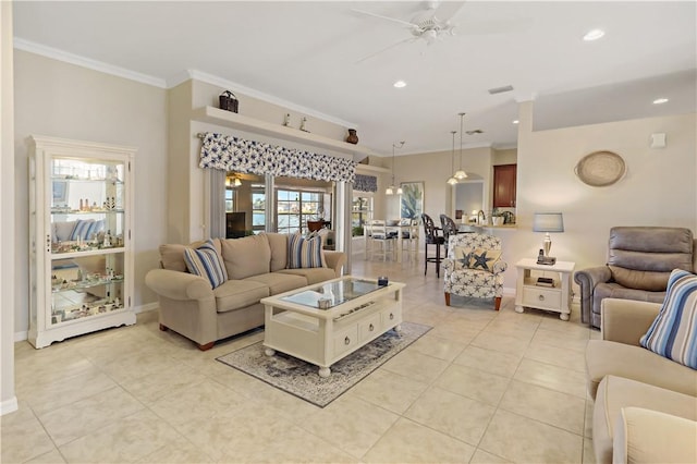 tiled living room with ceiling fan and ornamental molding