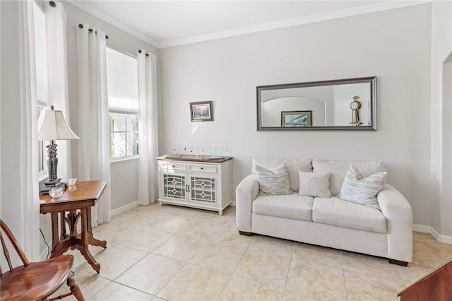 living area with tile patterned flooring, baseboards, and crown molding