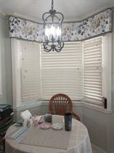 830 Lake Orchid Cir Unit 207, Vero Beach, FL 32962 - dining area with an inviting chandelier and crown molding