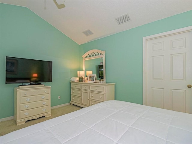 679 5th Ave, Vero Beach, FL 32962 - bedroom featuring baseboards, lofted ceiling, visible vents, and carpet floors