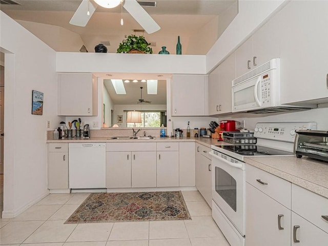 679 5th Ave, Vero Beach, FL 32962 - kitchen featuring white appliances, light tile patterned floors, light countertops, a ceiling fan, and a sink