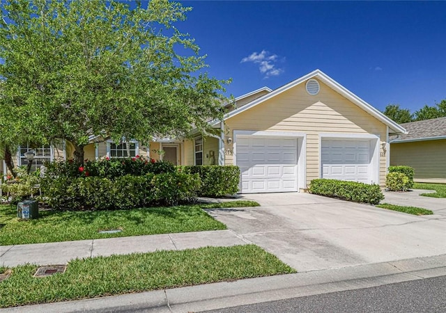 679 5th Ave, Vero Beach, FL 32962 - view of front of home with an attached garage and concrete driveway