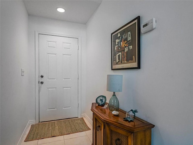 679 5th Ave, Vero Beach, FL 32962 - entryway with baseboards and light tile patterned flooring