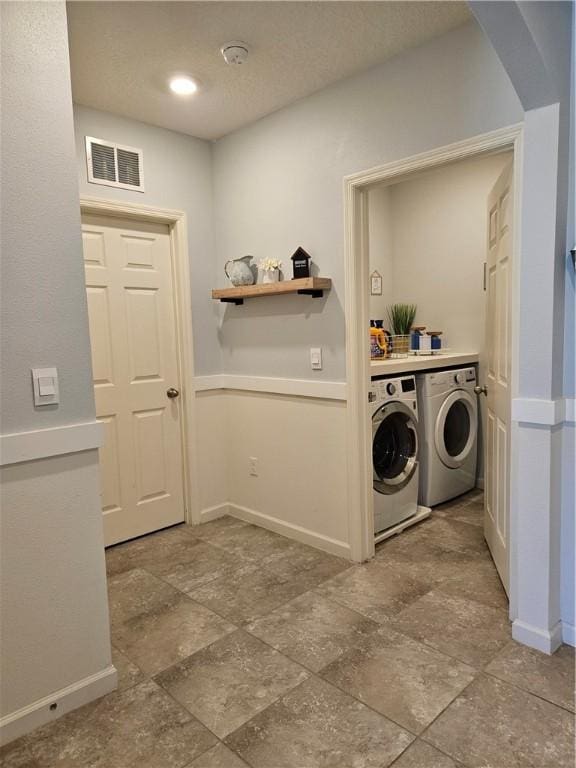 washroom featuring washing machine and dryer