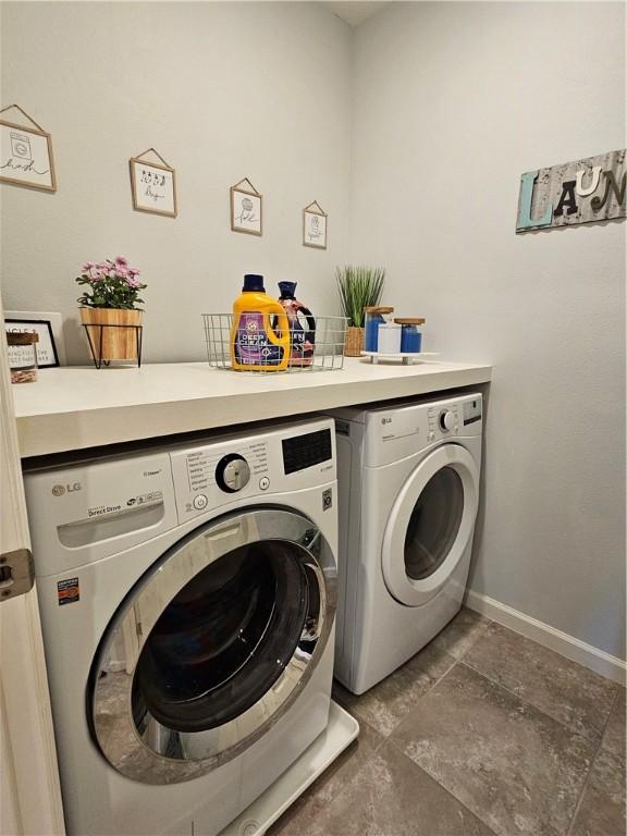 laundry area with washer and dryer