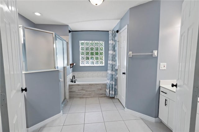 bathroom with tile patterned floors, separate shower and tub, and vanity