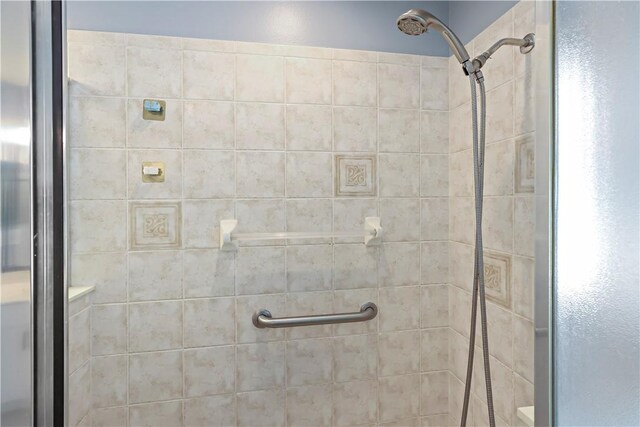 bathroom with a shower with shower door