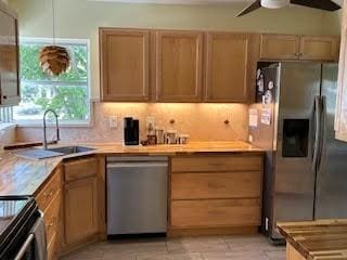 857 Dolores St, Sebastian, FL 32958 - kitchen with stainless steel appliances, a ceiling fan, and light countertops