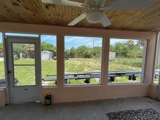 857 Dolores St, Sebastian, FL 32958 - unfurnished sunroom featuring ceiling fan
