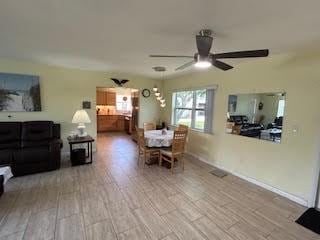 857 Dolores St, Sebastian, FL 32958 - dining room featuring a ceiling fan and wood finished floors