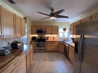 857 Dolores St, Sebastian, FL 32958 - kitchen featuring appliances with stainless steel finishes and a ceiling fan