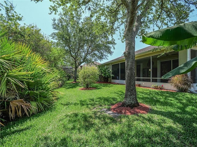 view of yard with a sunroom