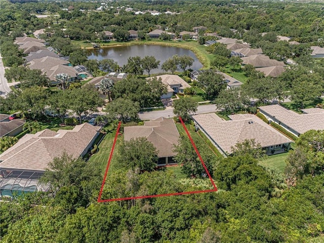 birds eye view of property featuring a water view and a residential view