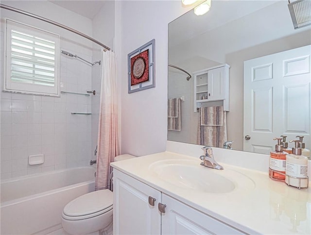 bathroom with shower / tub combo with curtain, vanity, and toilet