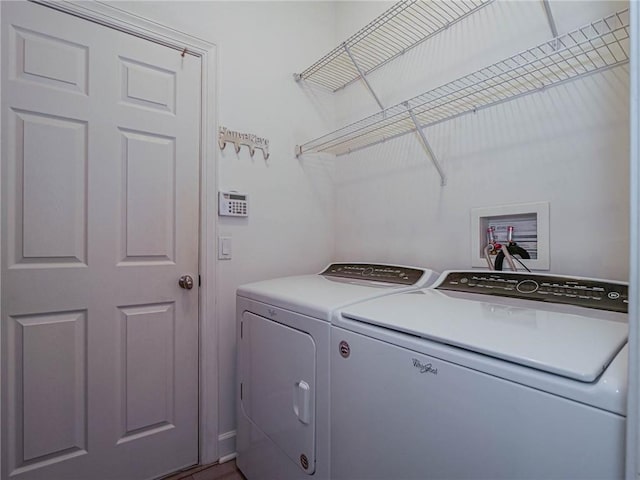 clothes washing area featuring laundry area and independent washer and dryer