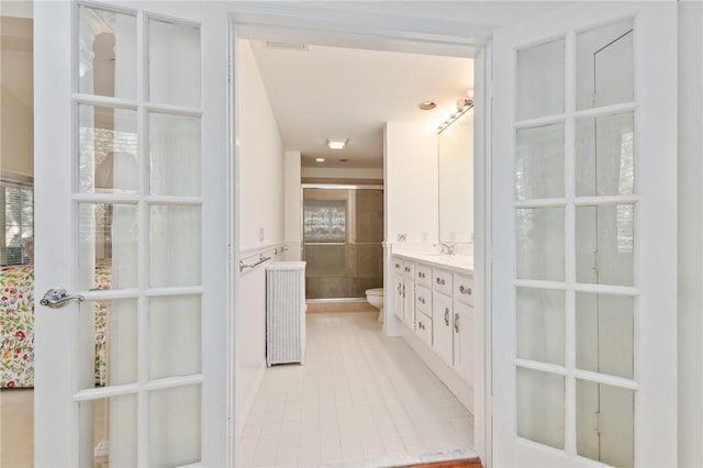 1300 Ivy Ct Unit 209, Vero Beach, FL 32963 - bathroom featuring toilet, tile patterned flooring, and vanity