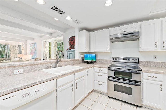 1300 Ivy Ct Unit 209, Vero Beach, FL 32963 - kitchen featuring double oven range, under cabinet range hood, white dishwasher, a sink, and light tile patterned floors