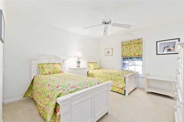 1300 Ivy Ct Unit 209, Vero Beach, FL 32963 - bedroom with light colored carpet, ceiling fan, and baseboards