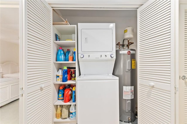 1300 Ivy Ct Unit 209, Vero Beach, FL 32963 - washroom with electric water heater and stacked washer / drying machine