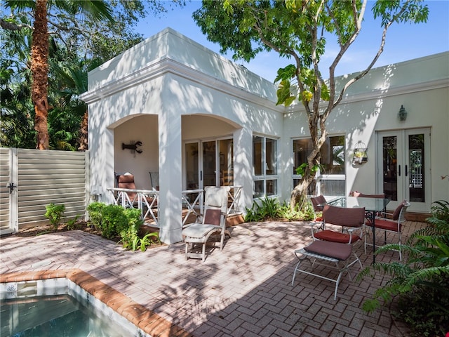 back of house with a patio area and french doors