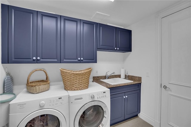 601 N Swim Club Dr Unit 3A, Vero Beach, FL 32963 - laundry area featuring cabinet space, separate washer and dryer, and light tile patterned floors