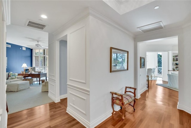 601 N Swim Club Dr Unit 3A, Vero Beach, FL 32963 - hall featuring an office area, light wood-type flooring, crown molding, and recessed lighting