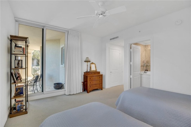 601 N Swim Club Dr Unit 3A, Vero Beach, FL 32963 - carpeted bedroom featuring ceiling fan and connected bathroom