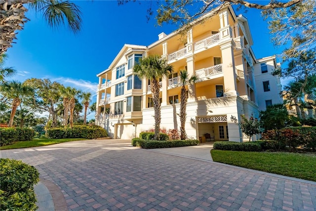 601 N Swim Club Dr Unit 3A, Vero Beach, FL 32963 - view of apartment building / complex with a garage and driveway