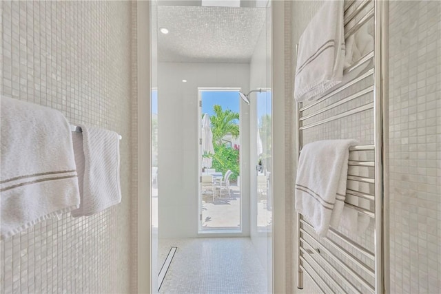 bathroom with tile patterned flooring and plenty of natural light