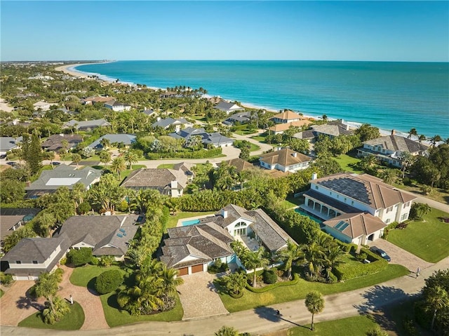 drone / aerial view with a residential view and a water view