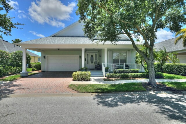 view of front facade featuring a garage and covered porch