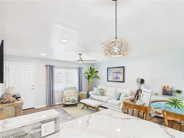 249 Columbus St, Sebastian, FL 32958 - living room featuring wood finished floors, baseboards, a ceiling fan, and recessed lighting