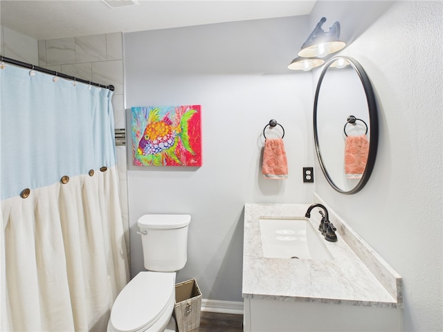 249 Columbus St, Sebastian, FL 32958 - bathroom featuring vanity, toilet, and a shower with shower curtain