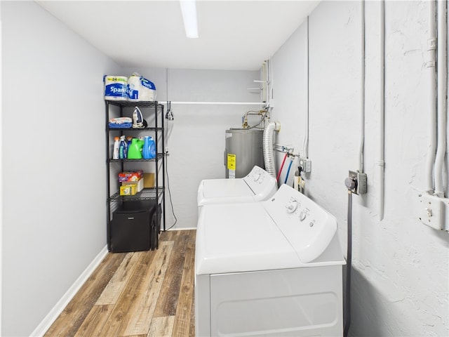 249 Columbus St, Sebastian, FL 32958 - laundry room with electric water heater, separate washer and dryer, and wood finished floors