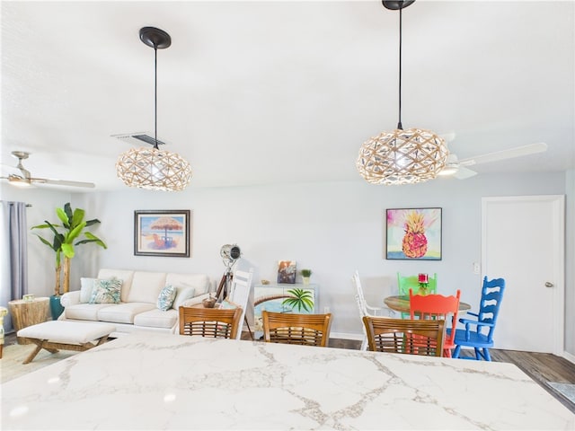 249 Columbus St, Sebastian, FL 32958 - dining space featuring ceiling fan, wood finished floors, and baseboards