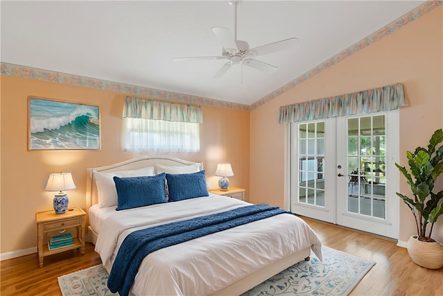2615 15th St, Vero Beach, FL 32960 - bedroom featuring vaulted ceiling, french doors, access to exterior, multiple windows, and wood finished floors